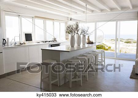 Stock Image - Interiors of the kitchen area in a studio apartment. Fotosearch