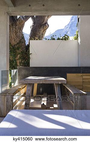 Picnic table and bench in a porch View Large Photo Image Stock Image - Picnic table and bench in a porch. Fotosearch