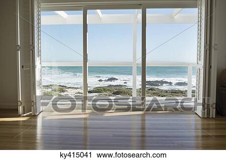 Stock Image - Sea viewed through from a glass door. Fotosearch