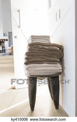 Stack of towels on a table View Large Photo Image Stock Photograph - Stack of towels on a table. Fotosearch