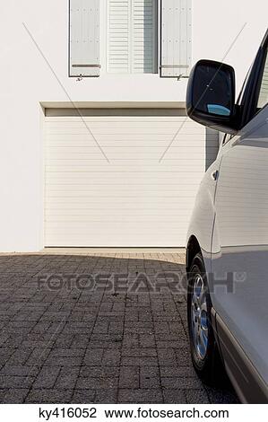 Car parked outside a building View Large Photo Image Stock Image - Car parked outside a building. Fotosearch