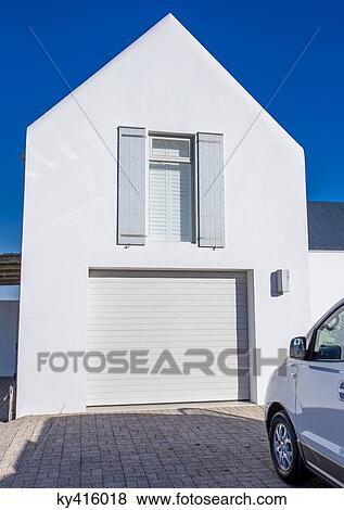 Stock Photo - Car parked outside a building. Fotosearch