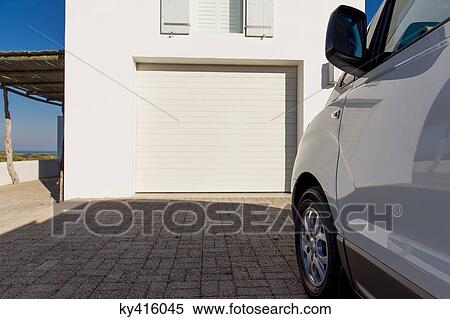 Car parked outside a building View Large Photo Image Stock Photography - Car parked outside a building. Fotosearch
