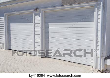 Closed shutters of a building View Large Photo Image Picture - Closed shutters of a building. Fotosearch