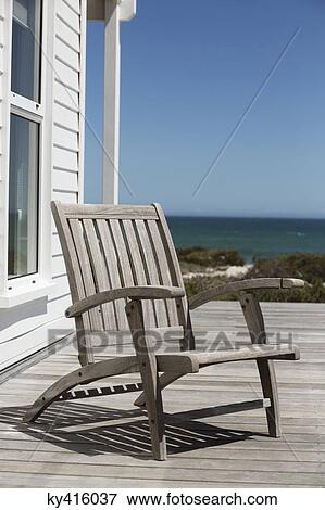Empty chair at a beach resort View Large Photo Image Stock Photo - Empty chair at a beach resort. Fotosearch