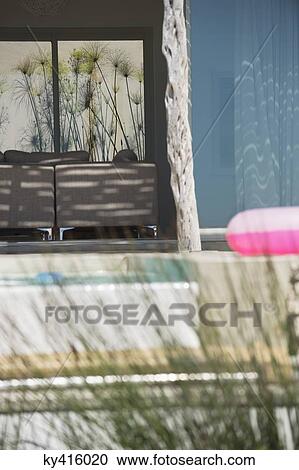Inflatable ring in the porch of a house View Large Photo Image Stock Image - Inflatable ring in the porch of a house. Fotosearch