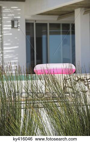Inflatable ring in the porch of a house View Large Photo Image Stock Photograph - Inflatable ring in the porch of a house. Fotosearch