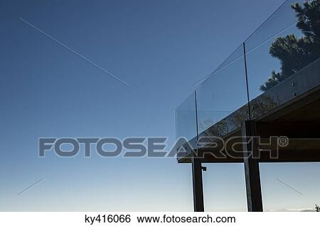 Low angle view of a terrace with glass railing View Large Photo Image Stock Photograph - Low angle view of a terrace with glass railing. Fotosearch