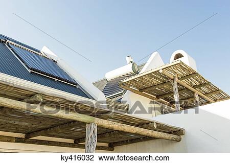 Solar panel on the roof of a house viewed from a terrace View Large Photo Image Stock Image - Solar panel on the roof of a house viewed from a terrace. Fotosearch