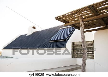 Solar panel on the roof of a house viewed from a terrace View Large Photo Image Stock Photography - Solar panel on the roof of a house viewed from a terrace. Fotosearch