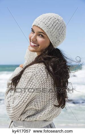 Beautiful woman enjoying on the beach in winter View Large Photo Image Stock Photo - Beautiful woman enjoying on the beach in winter. Fotosearch