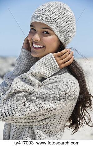 Beautiful woman on the beach in winter View Large Photo Image Stock Image - Beautiful woman on the beach in winter. Fotosearch
