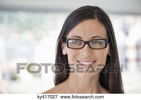 Close-up of a woman smiling View Large Photo Image Stock Photo - Close-up of a woman smiling. Fotosearch
