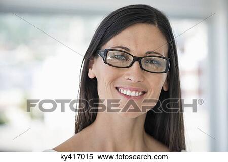 Close-up of a woman smiling View Large Photo Image Stock Photography - Close-up of a woman smiling. Fotosearch