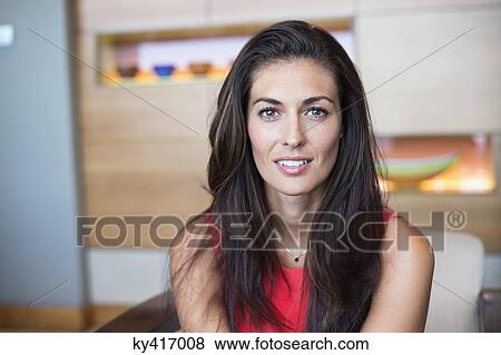 Portrait of a beautiful woman smiling View Large Photo Image Stock Photo - Portrait of a beautiful woman smiling. Fotosearch
