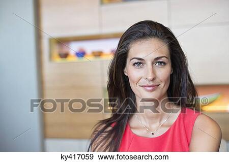 Portrait of a beautiful woman smiling View Large Photo Image Stock Photo - Portrait of a beautiful woman smiling. Fotosearch