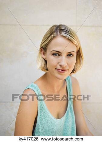 Portrait of a beautiful woman smiling View Large Photo Image Stock Photograph - Portrait of a beautiful woman smiling. Fotosearch