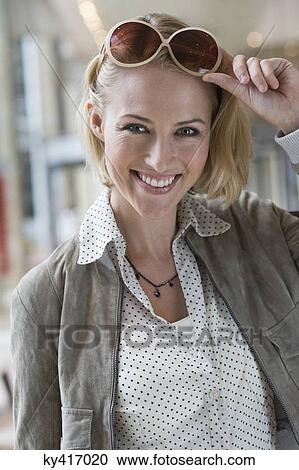 Stock Image - Portrait of a woman smiling. Fotosearch