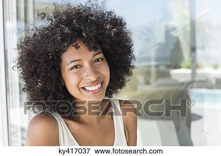 Portrait of a woman smiling View Large Photo Image Stock Photo - Portrait of a woman smiling. Fotosearch