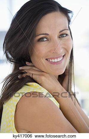 Portrait of a woman smiling View Large Photo Image Stock Photograph - Portrait of a woman smiling. Fotosearch