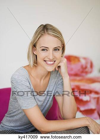 Smiling woman posing View Large Photo Image Stock Photo - Smiling woman posing. Fotosearch