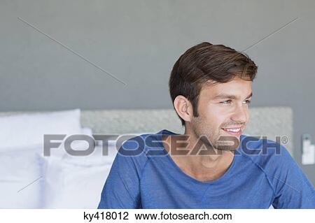 Close-up of a man smiling View Large Photo Image Stock Image - Close-up of a man smiling. Fotosearch