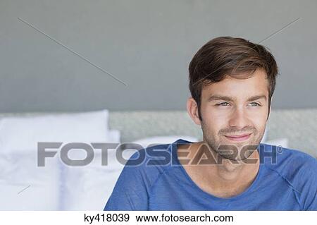 Close-up of a man smiling View Large Photo Image Stock Photo - Close-up of a man smiling. Fotosearch