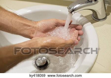 Close-up of a man washing his hands View Large Photo Image Stock Photo - Close-up of a man washing his hands. Fotosearch