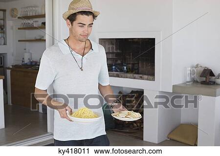 Man carrying plates of food View Large Photo Image Stock Image - Man carrying plates of food. Fotosearch