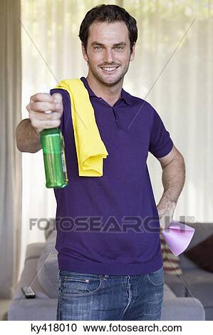 Man holding cleaning equipment and smiling View Large Photo Image Stock Image - Man holding cleaning equipment and smiling. Fotosearch