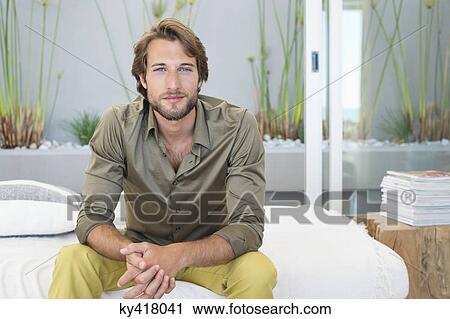 Portrait of a man sitting at home View Large Photo Image Stock Image - Portrait of a man sitting at home. Fotosearch