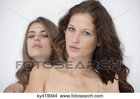 Portrait of two female friends posing View Large Photo Image Picture - Portrait of two female friends posing. Fotosearch