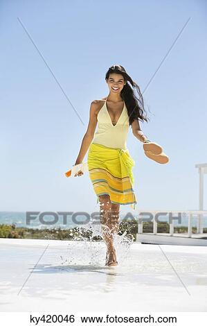 Beautiful woman enjoying on the beach View Large Photo Image Stock Photograph - Beautiful woman enjoying on the beach. Fotosearch