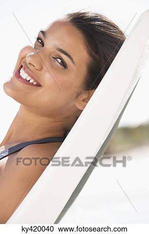 Beautiful woman sunbathing on the beach View Large Photo Image Stock Image - Beautiful woman sunbathing on the beach. Fotosearch