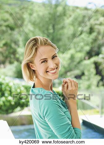 Portrait of a beautiful woman smiling View Large Photo Image Stock Photo - Portrait of a beautiful woman smiling. Fotosearch