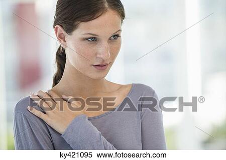 Stock Photography - Close-up of a beautiful woman looking away. Fotosearch