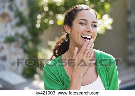 Stock Image - Close-up of a woman smiling. Fotosearch