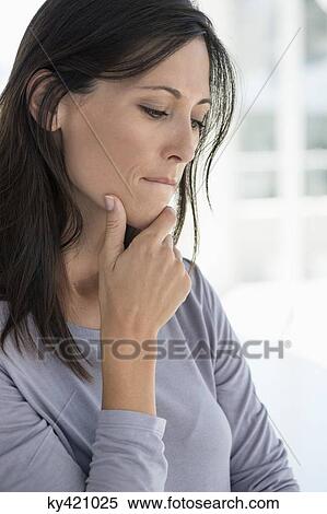Close-up of a woman thinking View Large Photo Image Stock Photography - Close-up of a woman thinking. Fotosearch