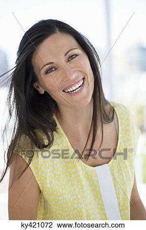 Portrait of a woman smiling View Large Photo Image Stock Image - Portrait of a woman smiling. Fotosearch