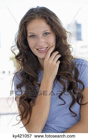 Portrait of a woman smiling View Large Photo Image Stock Photo - Portrait of a woman smiling. Fotosearch