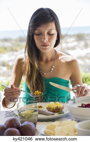 Woman enjoying lunch View Large Photo Image Stock Photograph - Woman enjoying lunch. Fotosearch