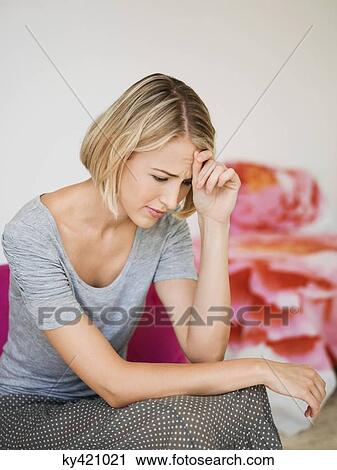 Woman sitting on an armchair and thinking View Large Photo Image Stock Image - Woman sitting on an armchair and thinking. Fotosearch