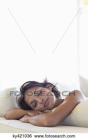 Stock Photograph - Woman sleeping on the bed. Fotosearch