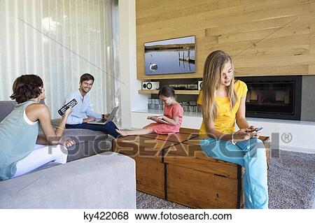 Family using electronics gadgets View Large Photo Image Stock Photo - Family using electronics gadgets. Fotosearch