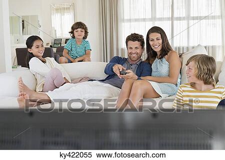 Family watching television View Large Photo Image Stock Photography - Family watching television. Fotosearch