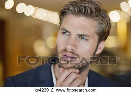 Stock Image - Close-up of a man looking away. Fotosearch