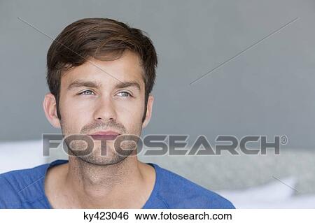 Close-up of a man thinking View Large Photo Image Stock Photograph - Close-up of a man thinking. Fotosearch