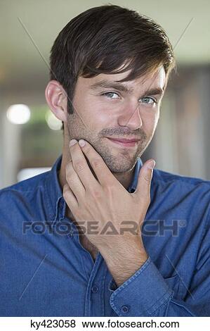 Portrait of a man smiling View Large Photo Image Stock Photo - Portrait of a man smiling. Fotosearch