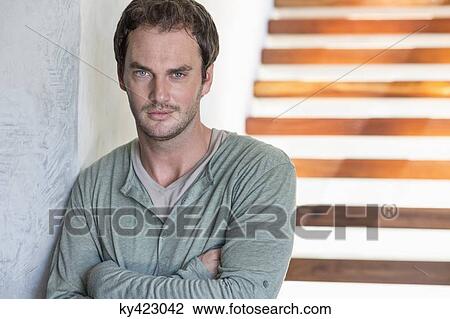 Portrait of a man with his arms crossed View Large Photo Image Stock Image - Portrait of a man with his arms crossed. Fotosearch
