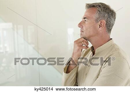 Close-up of a man thinking View Large Photo Image Picture - Close-up of a man thinking. Fotosearch